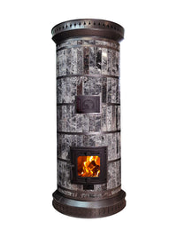 Front view of the Siberia model masonry heater kit in black amphibolite stone with black trim, featuring a glass firebox door with a wood fire burning.