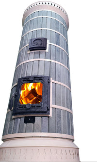 Low-angle view of the Siberia blue masonry heater, highlighting the tall cylindrical soapstone column and decorative white steel trim rings.