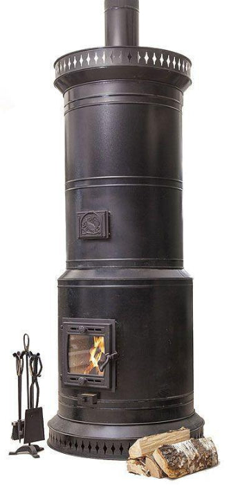 Venice 40 DIY masonry heater kit shown fully assembled with black steel cylindrical enclosure, glass fire door with wood fire burning, and fireplace tools.